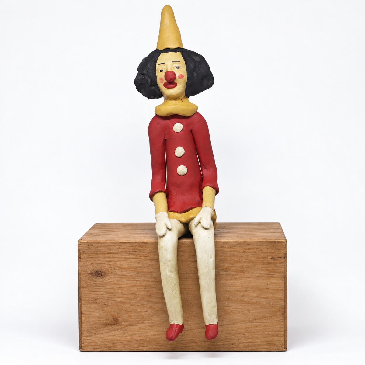 Escultura Palhaço Sentado em Cerâmica